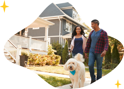 A family in front of their new home