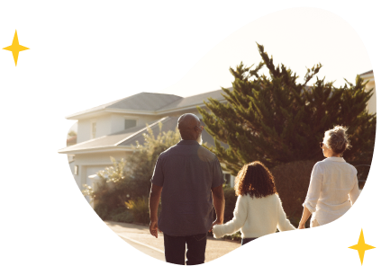 A family in front of their new home